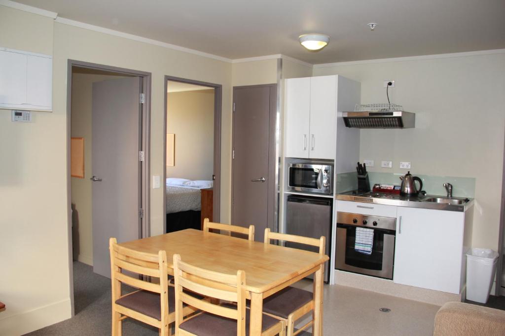 Kitchen, Nikau Apartments in Nelson