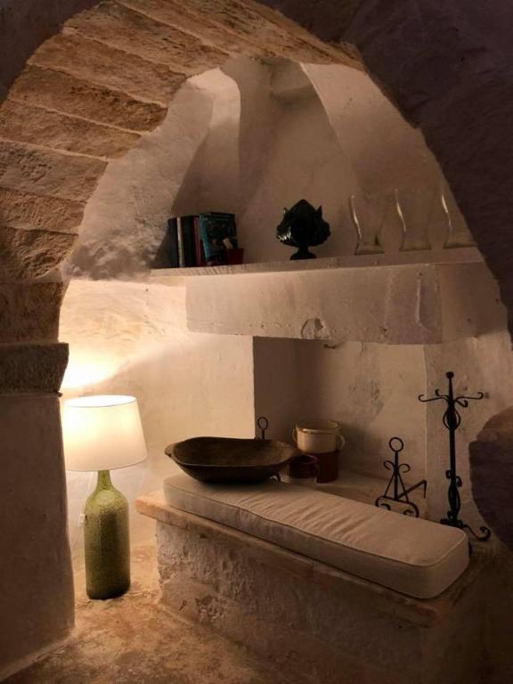 Traditional trulli house at Borgo Trulli 1789 with garden