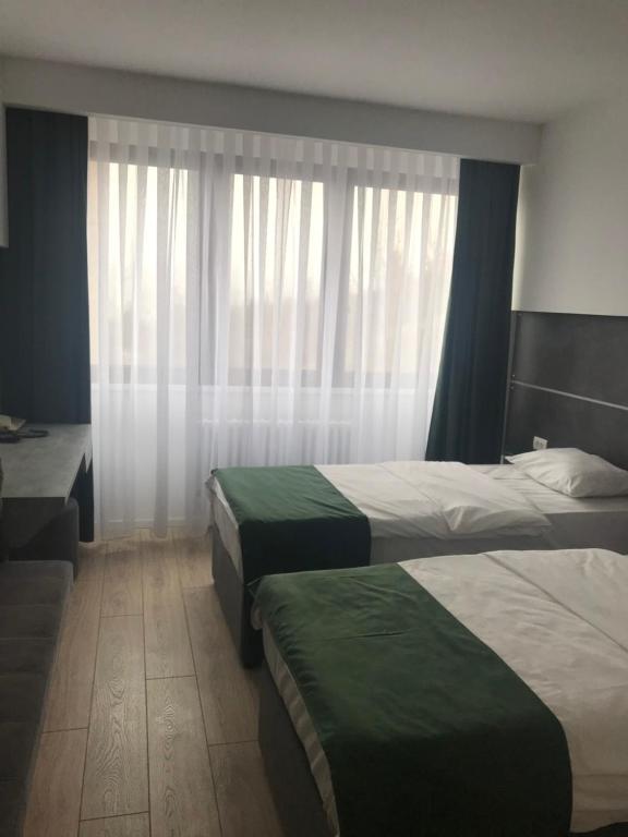 Deluxe szoba kétszemélyes vagy 2 külön ággyal - városra nyíló kilátással