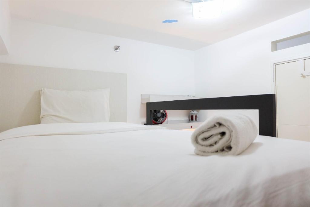 Elegant 2BR at 18th Floor Bassura City Apartment By Travelio, Jakarta