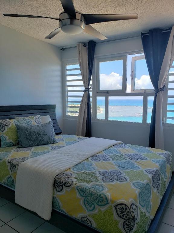Breezy beachfront property with view of paradise photo