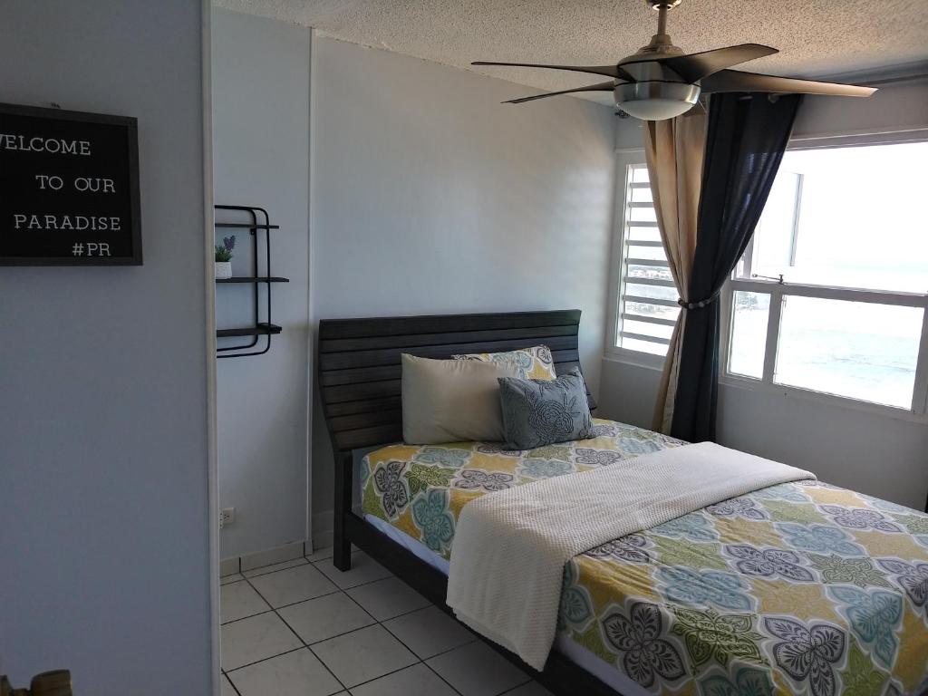 Breezy beachfront property with view of paradise photo