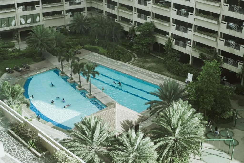 Tivoli Garden Residences 2212 Lovely stay in a 2-BR condo w/ Netflix and Balcony photo