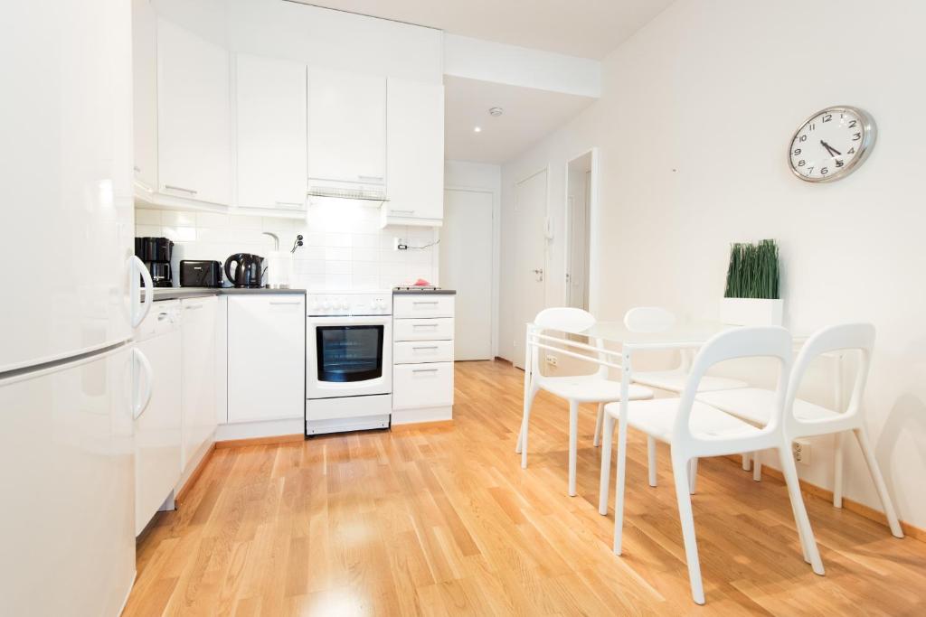 Kitchen, Kotimaailma Apartments Turku in Turku