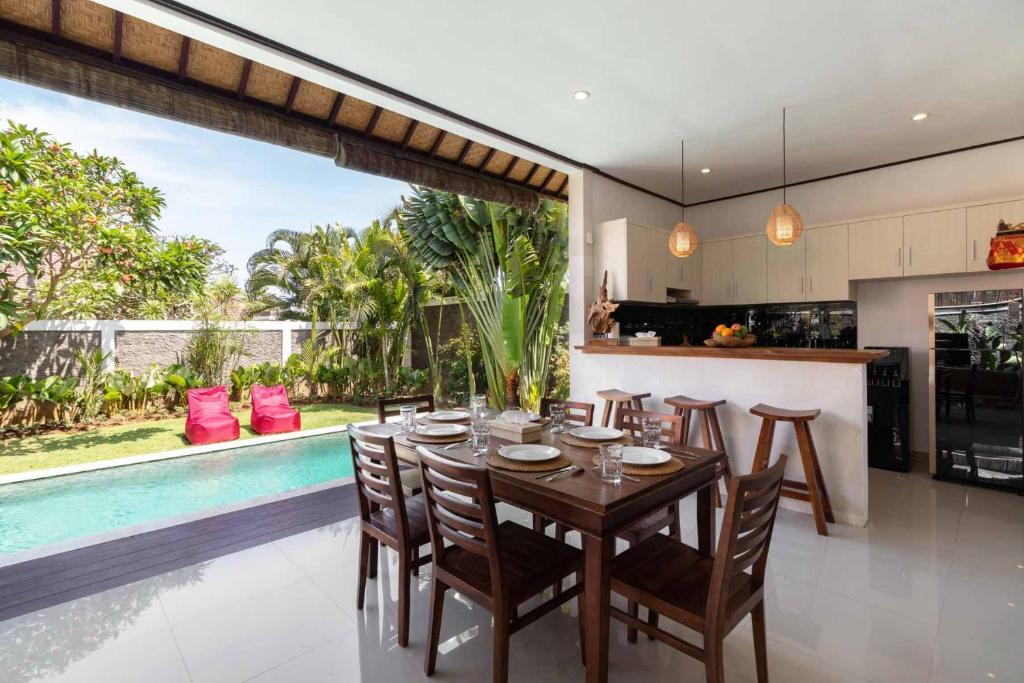opened living room with tropical garden view photo
