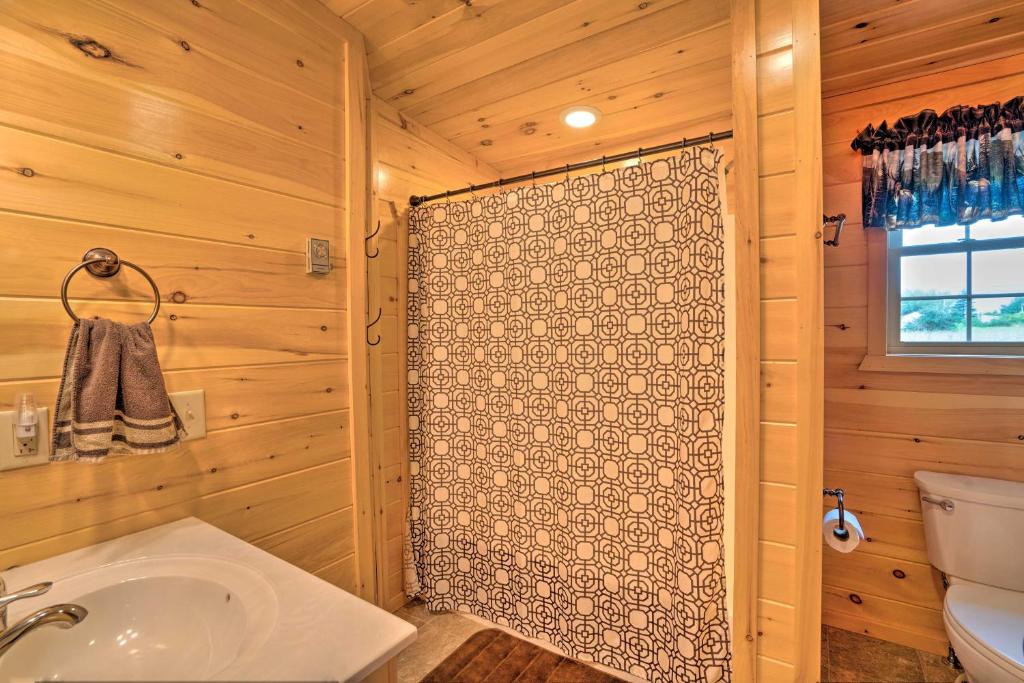Rustic Benezette Cabin with Porch, Hot Tub and Fire Pit photo