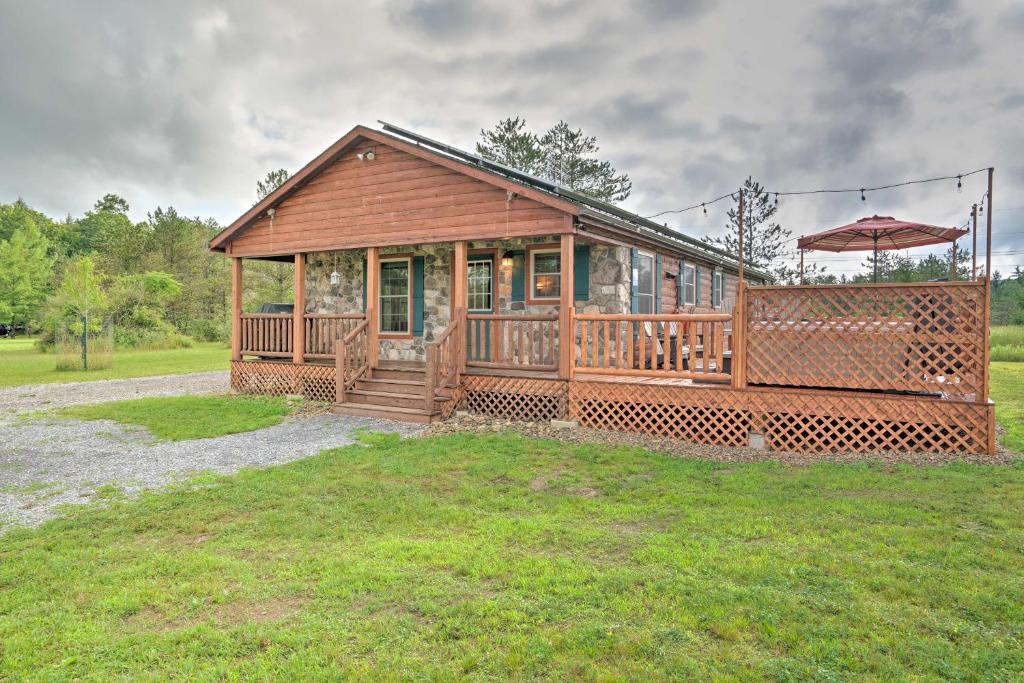 Rustic Benezette Cabin with Porch, Hot Tub and Fire Pit photo