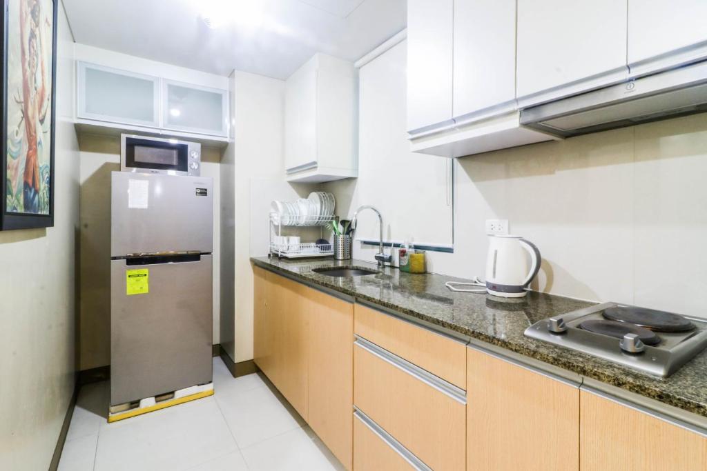 Kitchen, Spacious and Cozy Condo Unit Across NAIA Terminal 3 in Manila