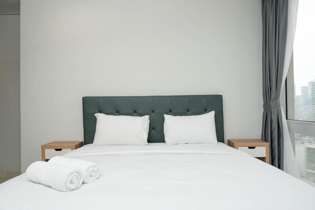 Cozy 2BR at Empyreal Epicentrum Apartment By Travelio, Jakarta