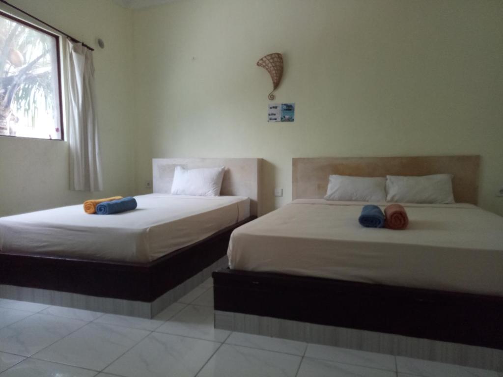 Amed Stop Inn Homestay, Rooftop Restaurant and Bar