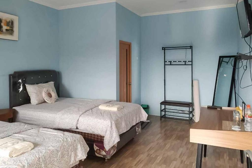 Kampung Abdi Resort Syariah Mitra RedDoorz