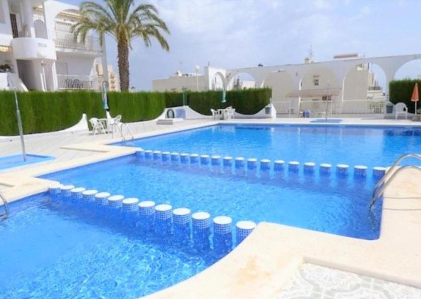 Apartment with pool, sea views & balcony less than 10min walk to La Mata Beach! photo