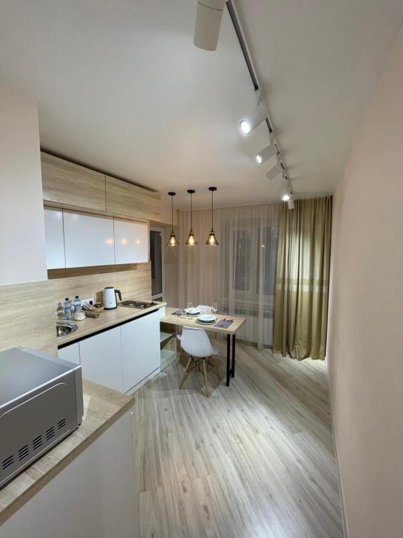 Kataeva 12 - Estaya Str by StayInn의 아늑한 주방 이미지입니다.