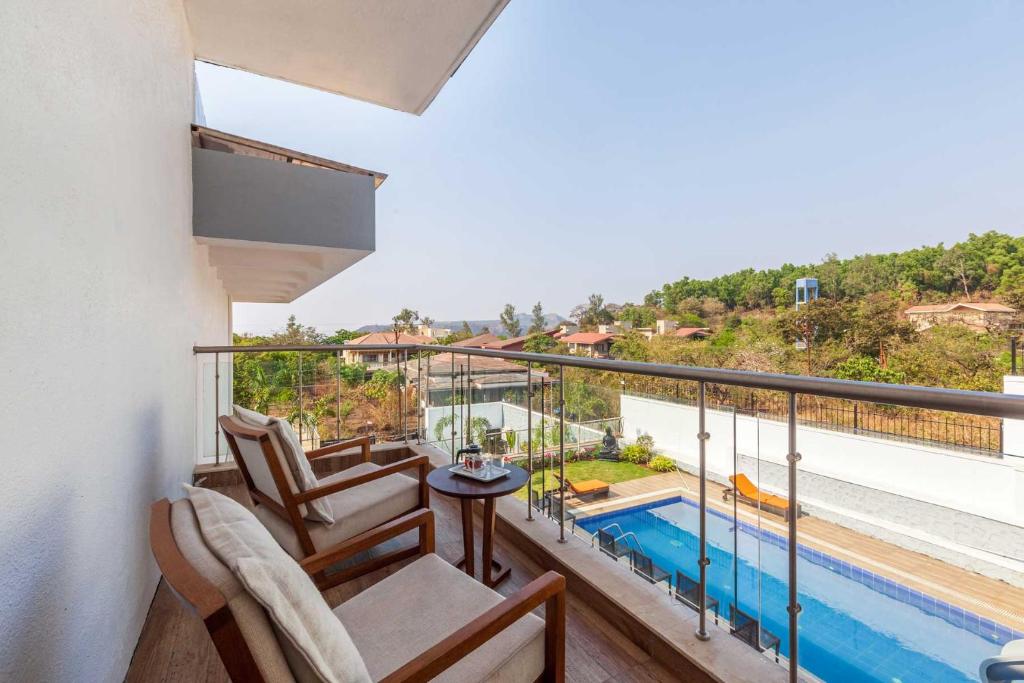 Balcony/terrace, StayVista's White Pebbles - A Villa with Theater Room & Swimming Pool in Lonavala