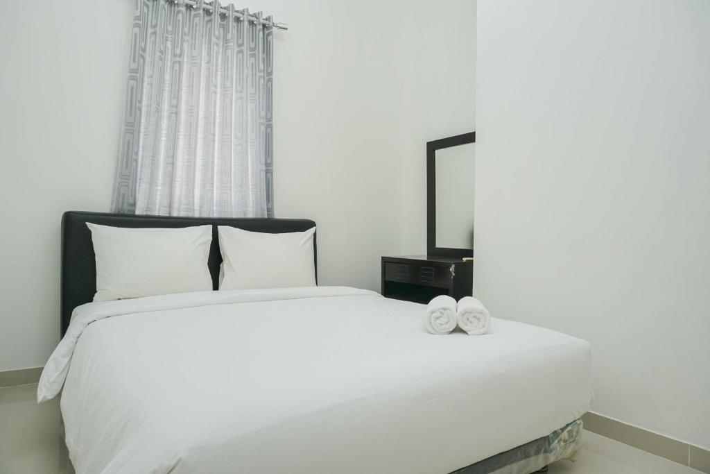 Fully Furnished with Comfortable 2BR Grand Palace Kemayoran Apartment By Travelio, Jakarta