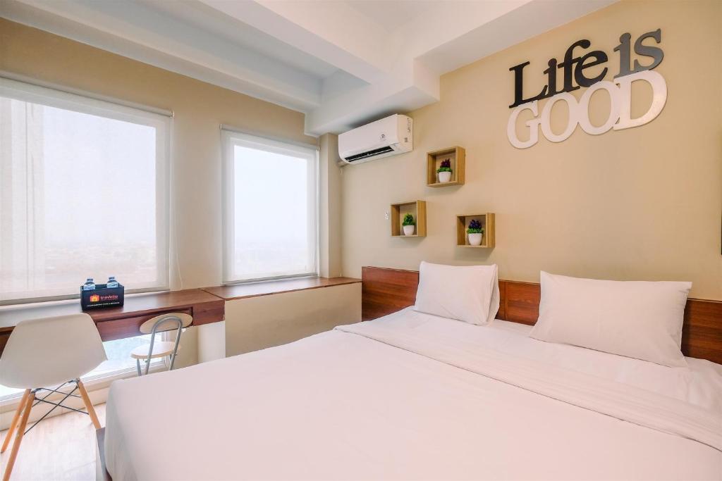 Modern and Compact Studio at Patraland Urbano Apartment By Travelio, Bulanbulan