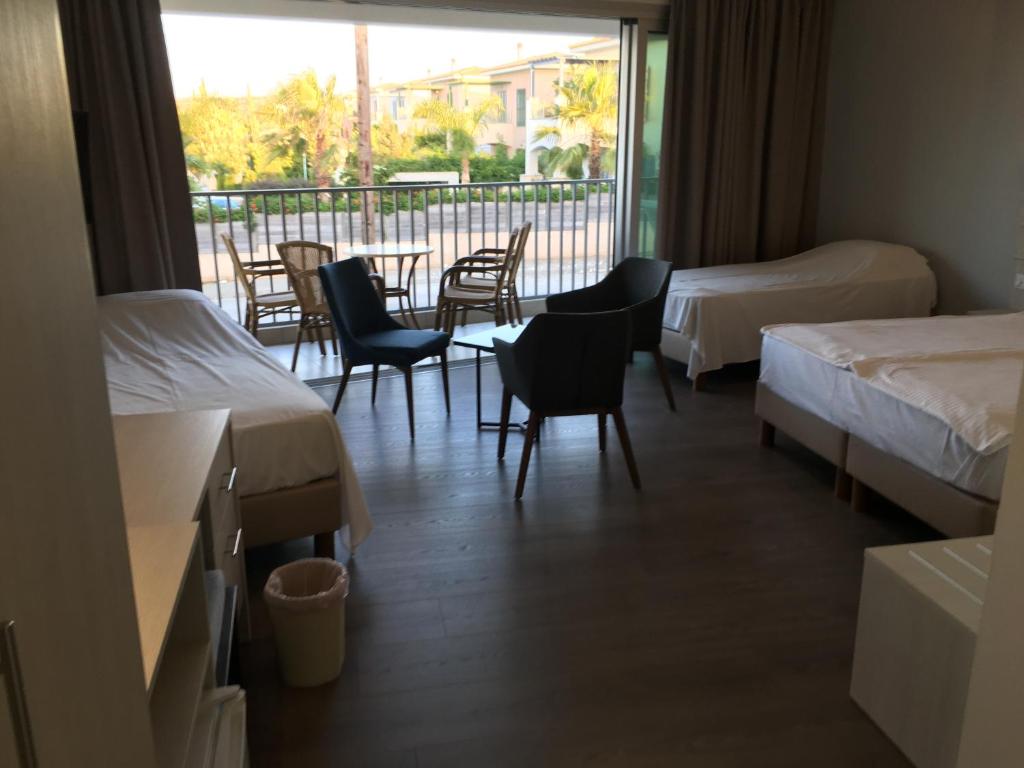Aphrodite Beach Hotel — Pokoje in Neo Chorio, Region Pafos