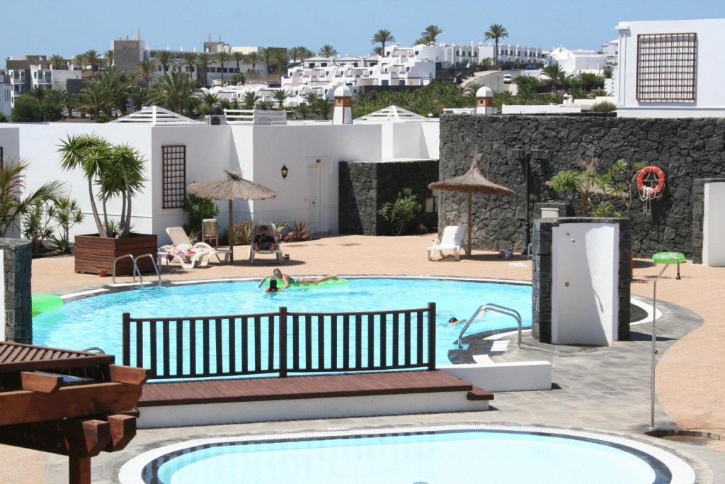 Apartamentos LIVVO Coloradamar — Swimming pool in Playa Blanca, Canary Islands