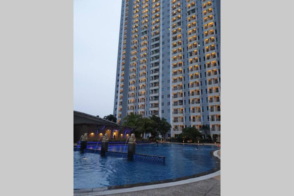 Cosmy Orchard Apartment at Pakuwon Mall with Wifi photo