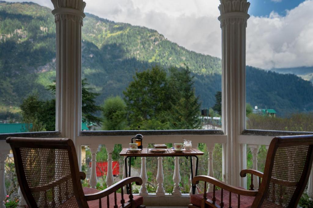 StayVista at The Lama House with huge lawn and valley view photo