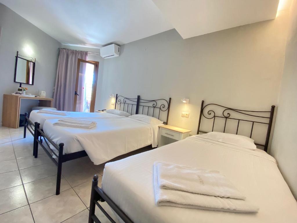 Louvre Hotel — Hotel rooms in Gouvia, Ionian Islands