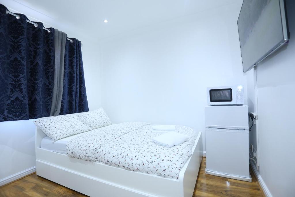 Cosy Room with en-suite bathroom and shared kitchen — Hotel in London