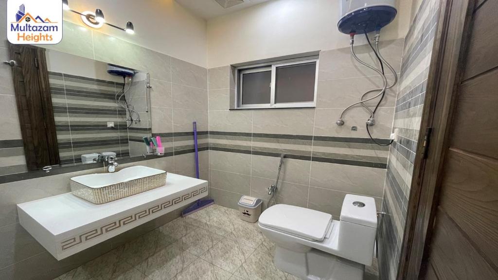 Multazam Heights, DHA Phase 8 - Three Bedrooms Family Apartments photo