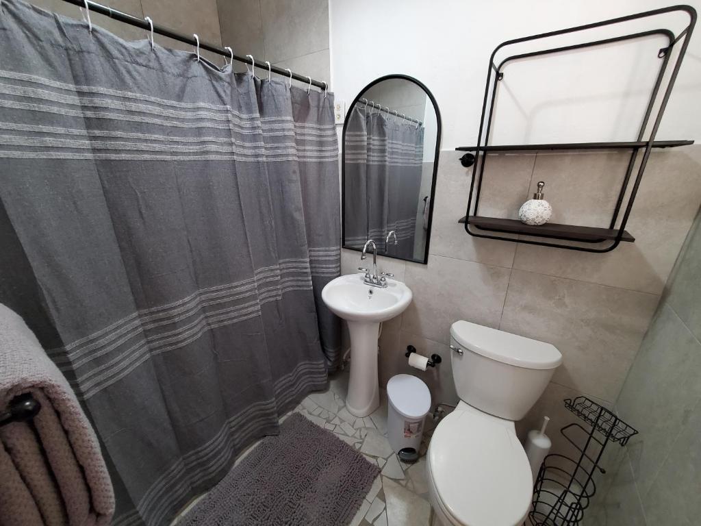Aguadilla Surfers Lair apt with electricity water AC Wifi 8 minute walk to Crashboat beach photo