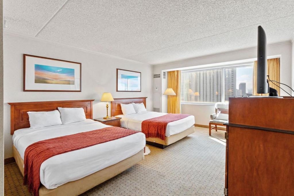 Two Beachfront Hotel Rooms next to each other by CozySuites