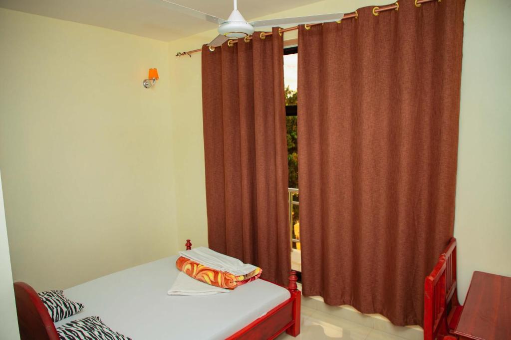 Kitano Tours and Safaris - KILIMANJARO WHITE HOUSE HOTEL - Tanzania Serengeti safari & Mount Kiliman photo