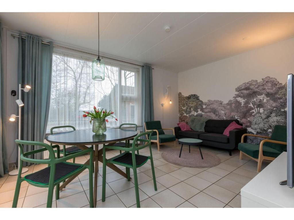 Apartment on an arable farm with mini campsite and playground