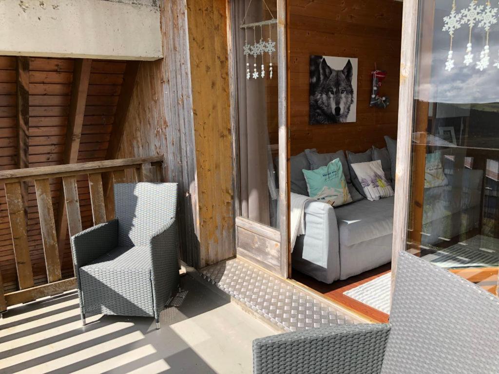 Interior view of Lama-Gite-des-Puys apartment showcasing its modern comfort and possibly the terrace