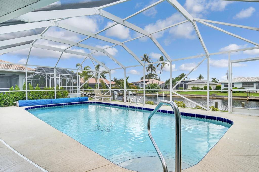 Reduced Rates - Waterfront Heated Pool Home with dock, grill, near Fisherman's Village, Punta Gorda