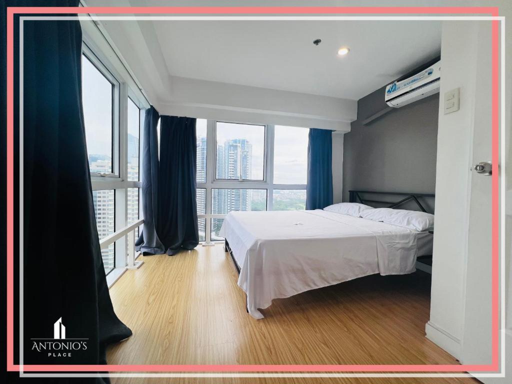 Big Windows with Full City View 2BR Loft Unit FREE WIFI & NETFLIX at Fort Victoria BGC photo