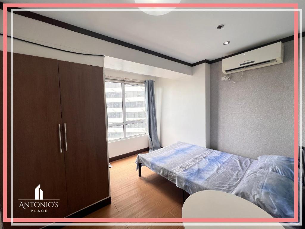 Captivating View of BGC Loft Unit FREE WIFI & NETFLIX at Fort Victoria BGC photo