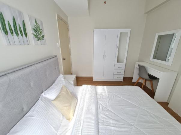 Lovely 2- BR Condo (Fully Air-conditioned w/ Wifi) photo