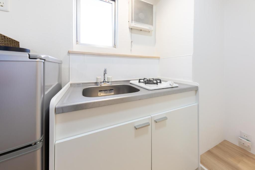 Tabist Motodai Business Hotel Kanonji 전경