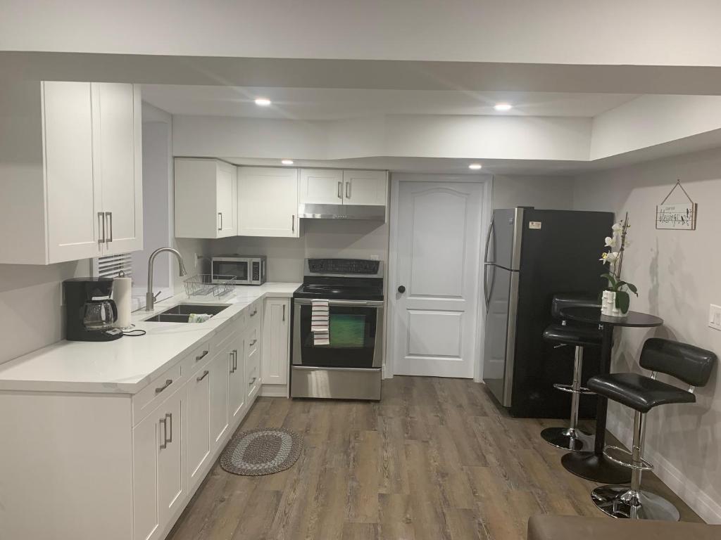 Cozy basement suite exuding Luxury Location & Convenience! photo