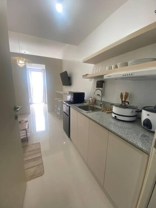 1BR unit in South Residence Las Pinas with Wifi & Netflix photo