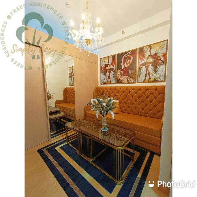 Simply COZY at Trees Residences 1 Br with Balcony photo