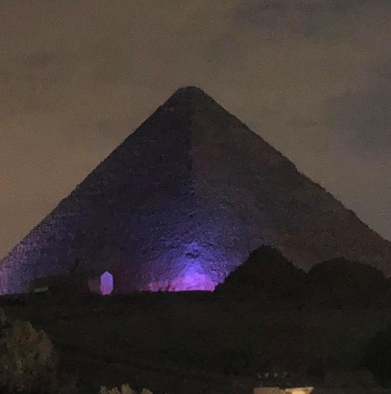 Sphinx palace pyramids view photo
