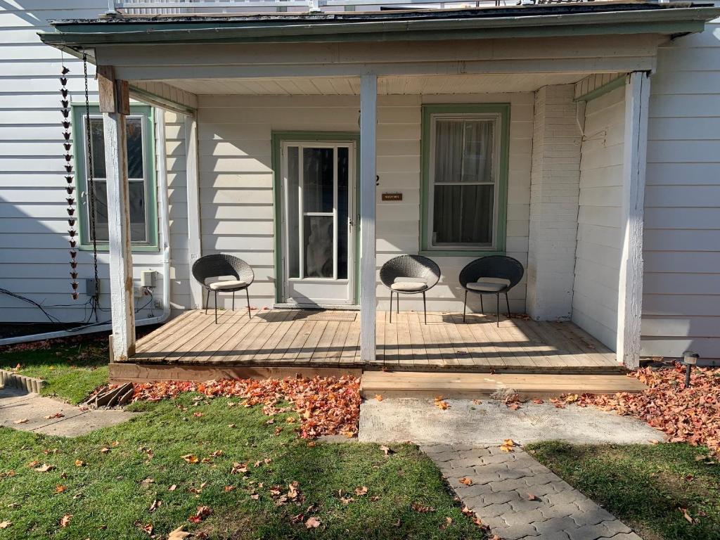 Lotus Landing, tranquil, private and central main level 1-bedroom unit in cozy historic home with fireplace, deck, yard, free parking, and laundry
