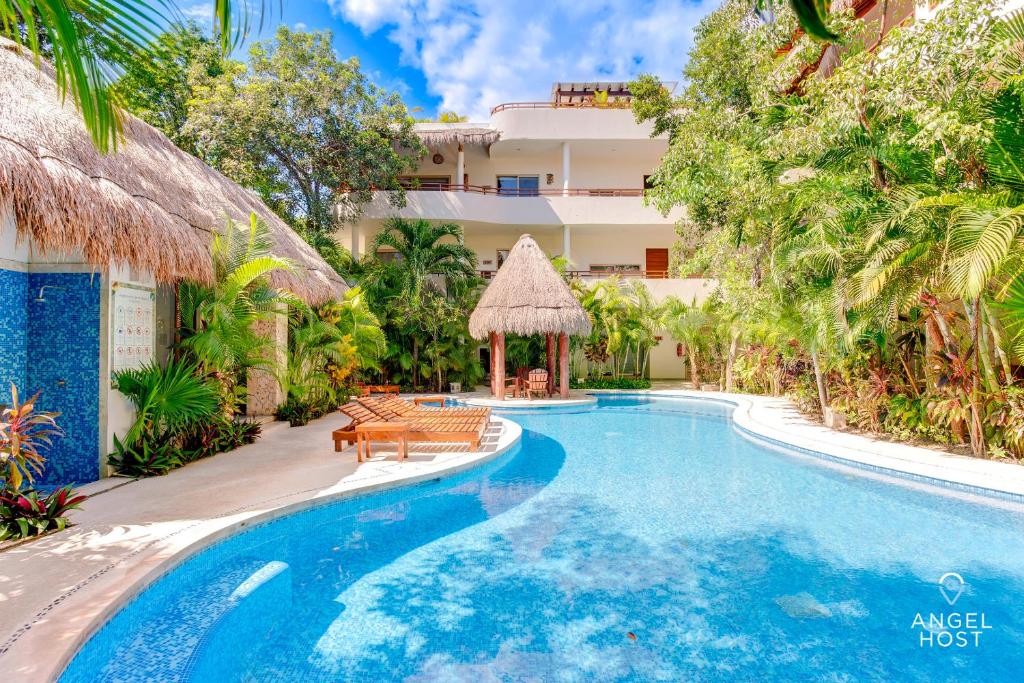 Condo Complex with an Alluring Pool & Tropical Vibes by Stella Rentals photo