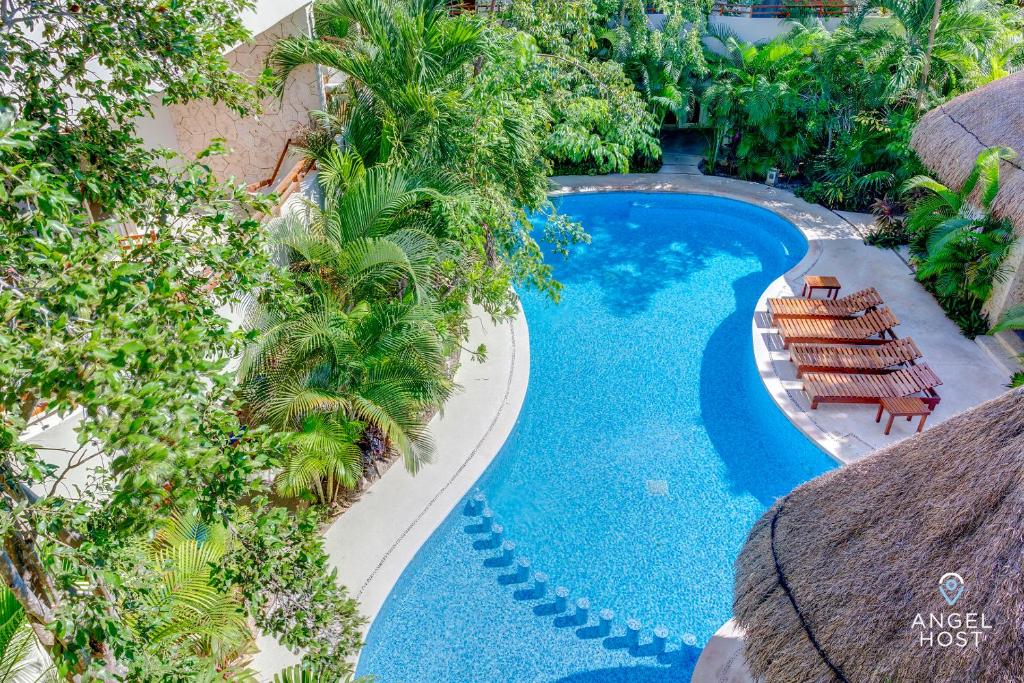 Condo Complex with an Alluring Pool & Tropical Vibes by Stella Rentals photo