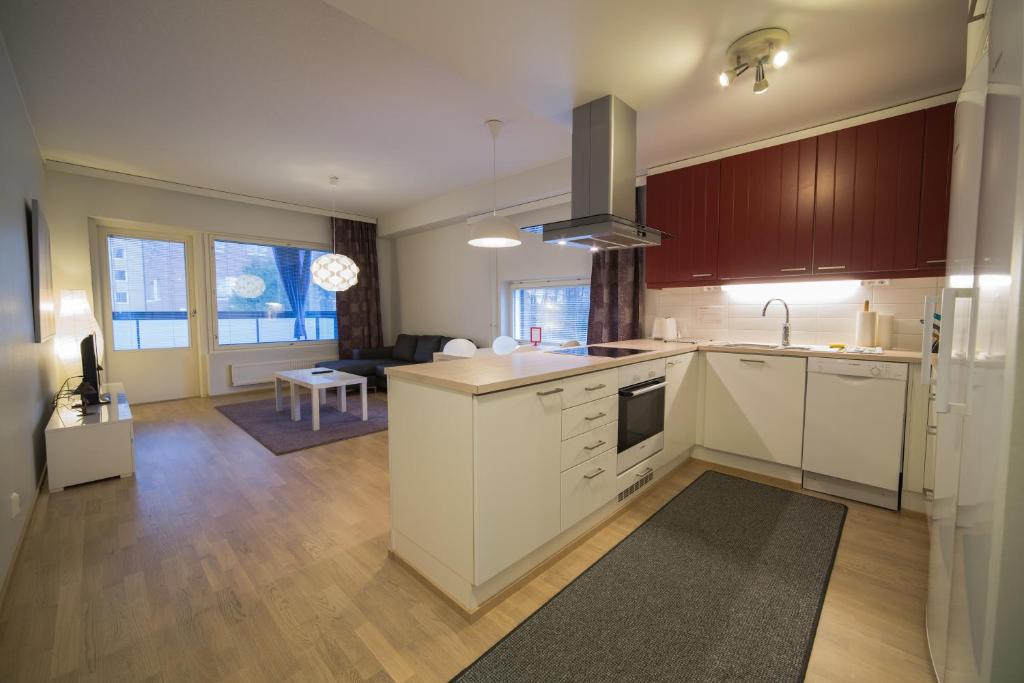 Kitchen, Kotimaailma Apartments Turku in Turku