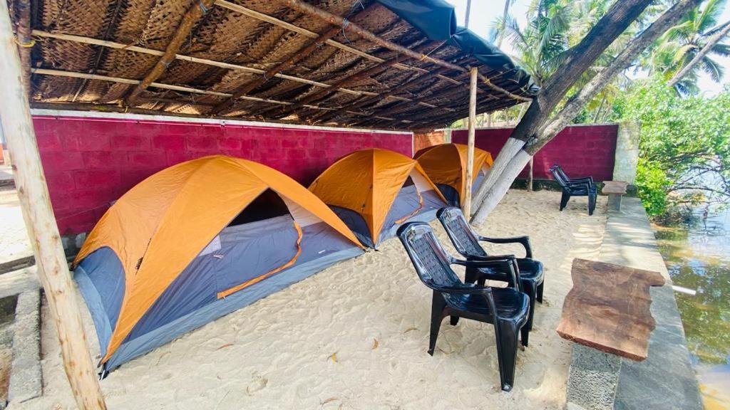 Tents in between ocean and River photo