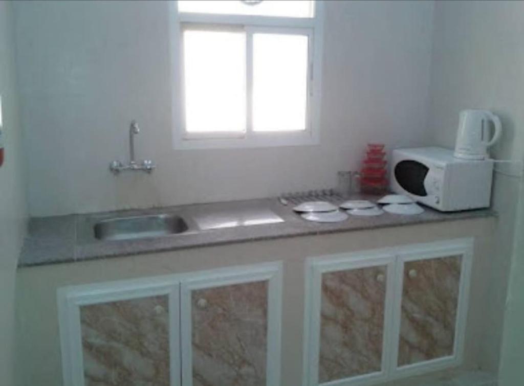 Kitchen, Al Basateen Hotel Apartment in Sur
