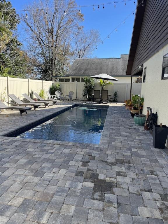 Close to beach! Family-sized home with pool and hot tub.