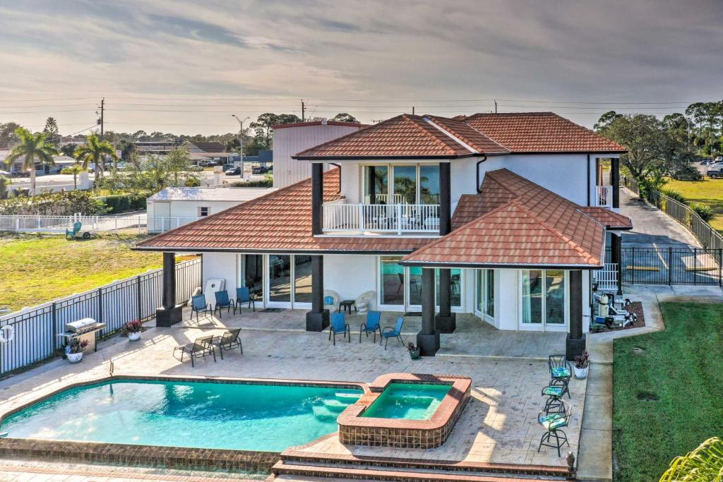 Riverfront Titusville Resort Home with Infinity Pool photo