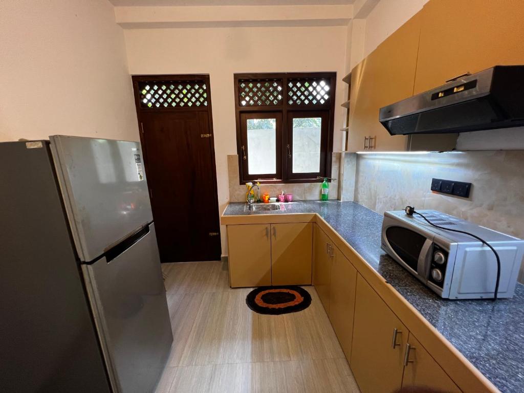 Kitchen, Natures Bliss Holidays in Wattala